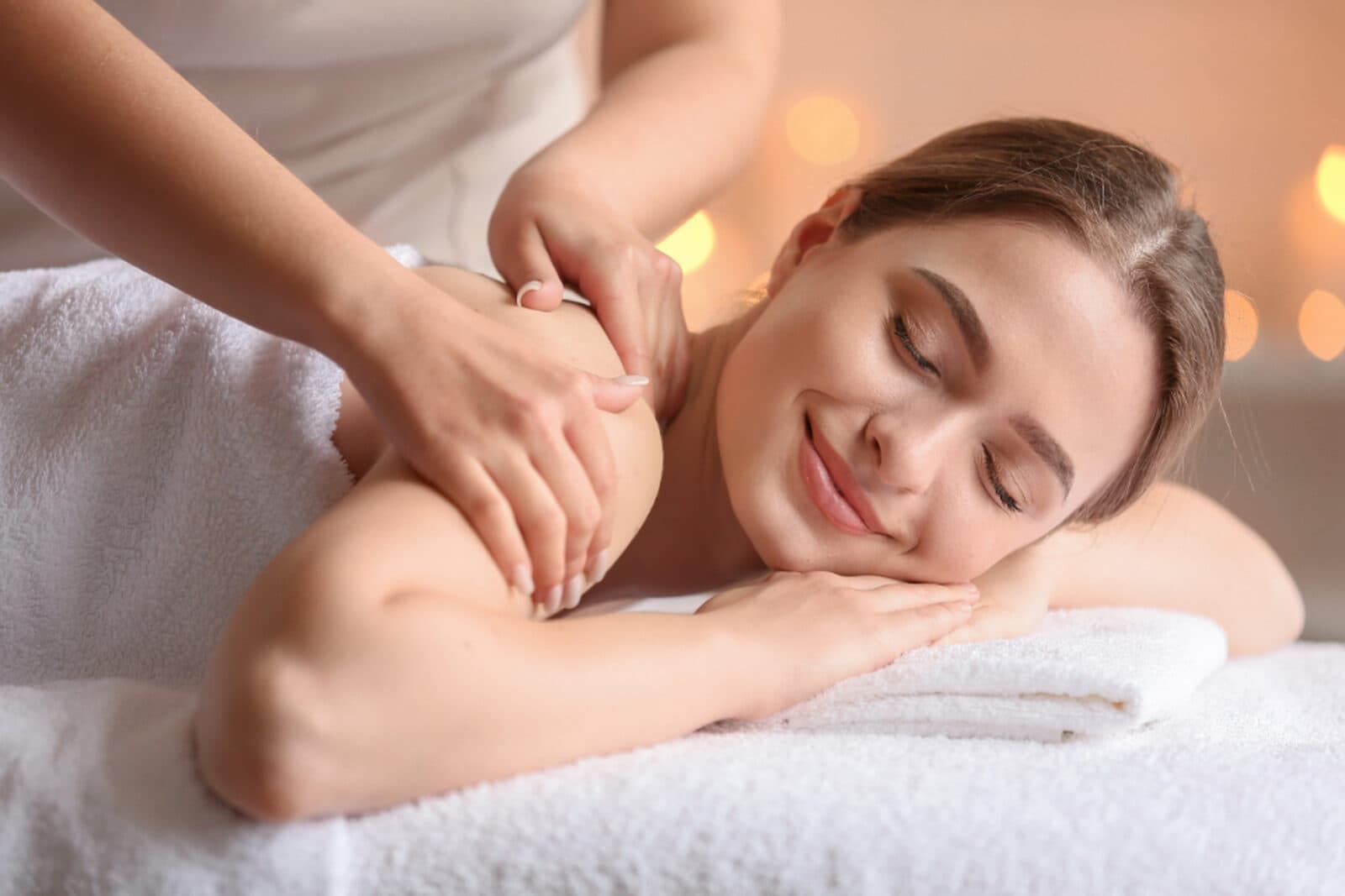 A firm, focused massage working into the muscles of the back