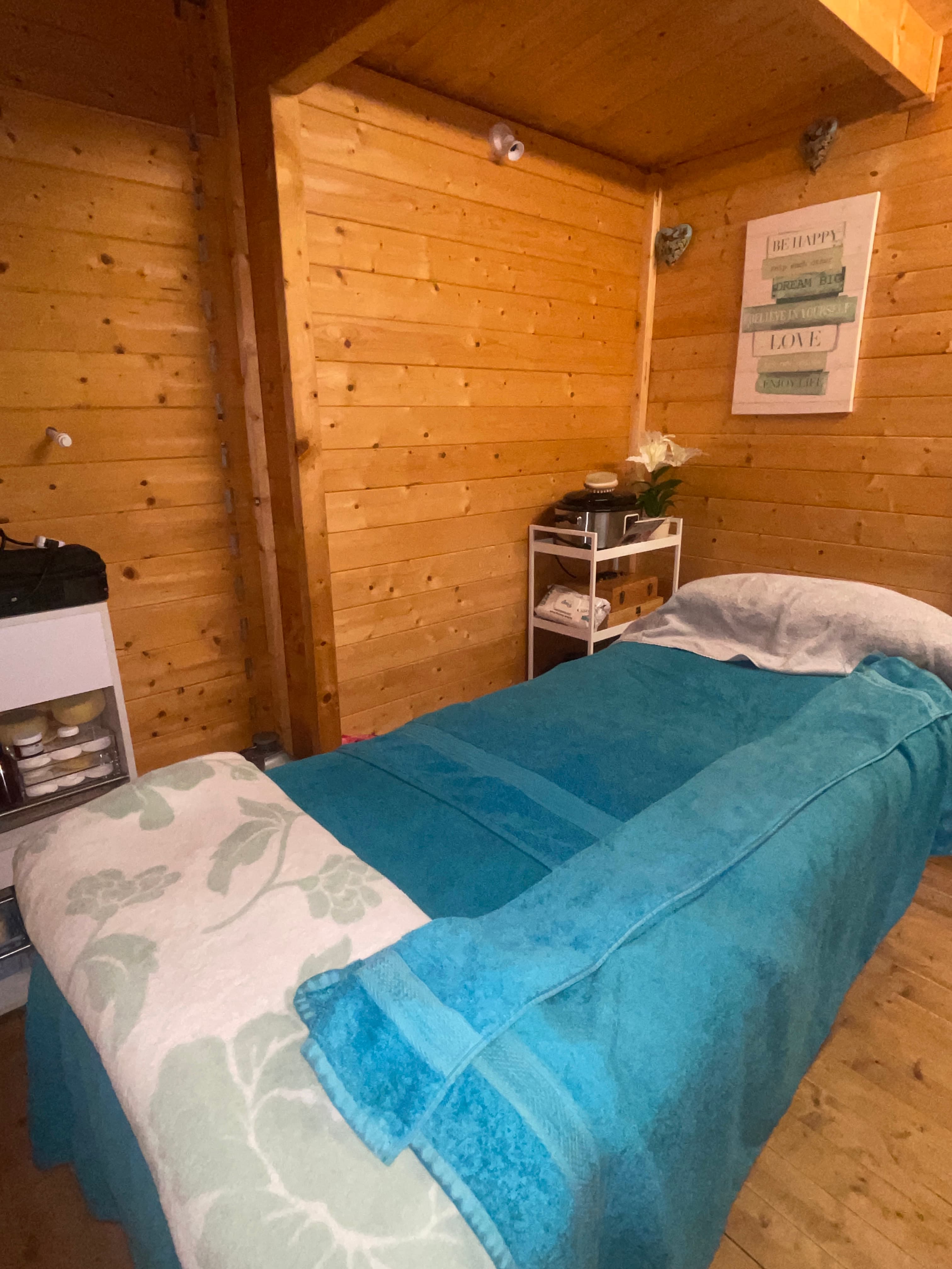 Inside the Essential Massage log cabin studio, the private treatment room in Stoke-on-Trent