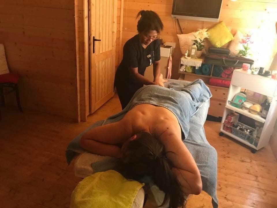 Francia Gregory, FHT-accredited pregnancy massage therapist, mid-treatment in the studio